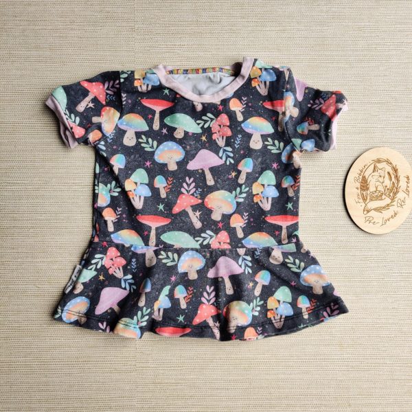 PRE-LOVED; RE-LOVED Age 6-12m Peplum T GUC Magical Mushrooms/Baby Pink with Poppered Neckline