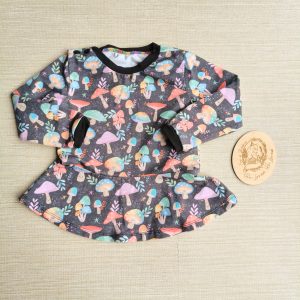 PRE-LOVED; RE-LOVED Age 2 Long Sleeve Peplum T GUC Magical Mushrooms/Black with poppered neckline